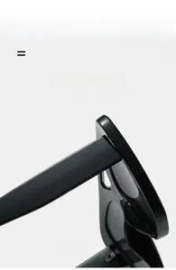 Detailed close-up showing light texture material and elastic hinge of black sunglasses