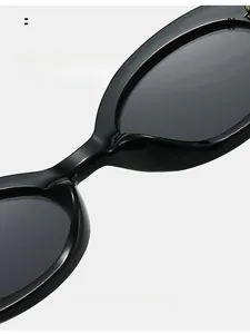 Detail of comfortable integrated nose pads on black oval sunglasses for long-term wear