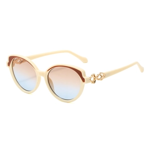 Retro round cat-eye sunglasses with cream frames and blue-orange gradient lenses