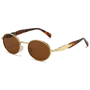 Retro oval metal sunglasses with gold frame and brown lenses shown at a side angle