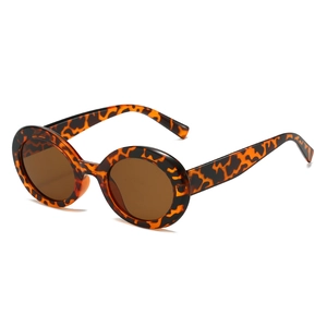 Retro tortoise shell oval sunglasses with dark brown lenses and polished frame finish