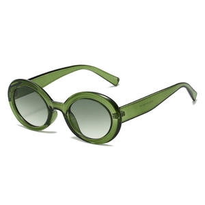 Retro translucent green oval sunglasses with gradient lenses and UV protection