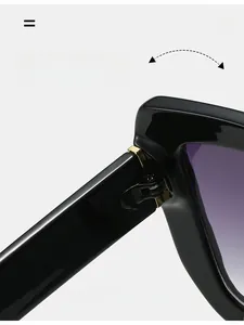 Macro shot of durable golden metal hinges on black square sunglasses with purple lenses