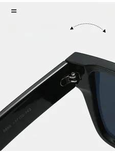 Close-up of black acetate sunglasses hinge with detailed model parameter engraving
