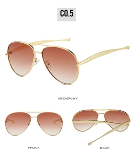 Detail view of gold metal aviator sunglasses with brown gradient lenses and double bridge
