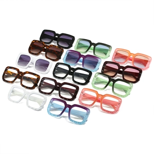 Multiple stylish oversized square sunglasses in assorted colors on white background