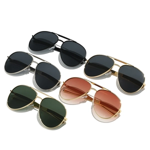 Five pairs of classic aviator sunglasses with metal double bridge frames in various lens colors