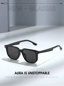 Detail view of square black sunglasses with silver accents in a minimalist studio setting