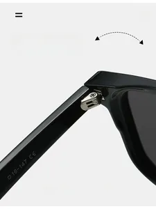 Detail shot of sturdy metal hinges and CE certification mark on black sunglasses frames