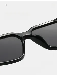 Close-up of integrated smooth nose pads on black square sunglasses for comfort
