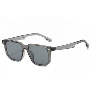 Modern square sunglasses with transparent grey frame and silver rivets in 45-degree view