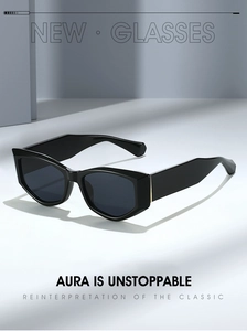Détail de lunettes de soleil œil-de-chat géométriques noires avec finition brillante chic
