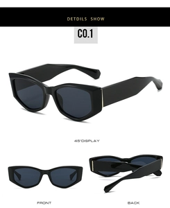 Vue détaillée des lunettes de soleil noires épaisses avec charnières dorées chic