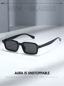 Macro detail of black square sunglasses featuring metallic rivets and glossy finish