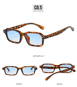 Detail view of tortoiseshell rectangle sunglasses with light blue gradient lenses