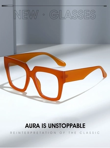 Detail of trendy orange square glasses frame with wide temples and modern acetate texture