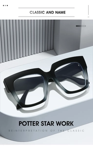 Detail of square black-grey gradient frames on a minimalist white curved display stand