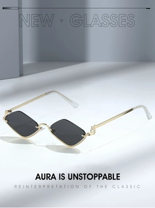 Detail view of gold metal half-frame sunglasses with geometric diamond-shaped dark lenses