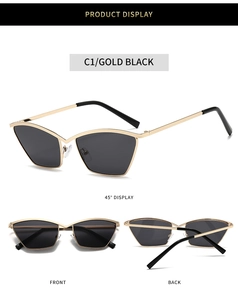 Detail view of gold metal cat-eye sunglasses with dark lenses and sleek geometric frame