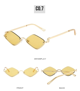 Macro detail of geometric yellow diamond sunglasses with gold metal semi-rimless frames