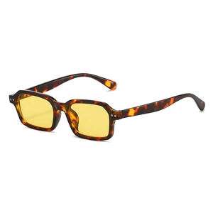 Fashionable rectangle tortoiseshell sunglasses with yellow lenses and rivet details