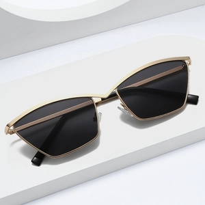 Fashionable gold metal cat-eye sunglasses with irregular geometric dark grey lenses