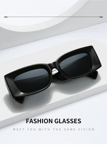 Detail of matte black rectangular sunglasses on a white geometric display stand