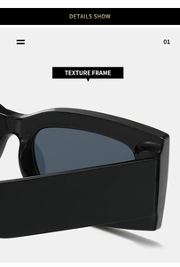 Detailed close-up showing the glossy black texture frame of oversized sunglasses