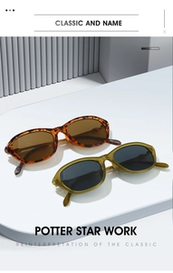 Close-up of stylish tortoiseshell and olive green cat-eye sunglasses on display