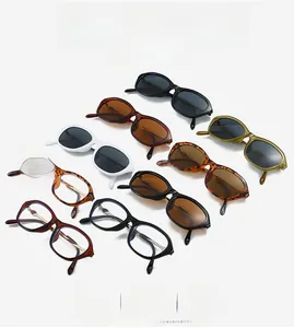 Flat lay of retro oval cat-eye sunglasses and clear lenses in multiple frame colors