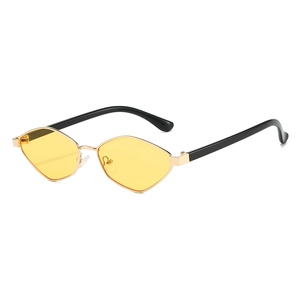 Modern irregular polygon sunglasses with yellow lenses and golden metal frames