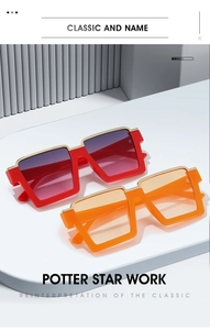 Detail of square oversized sunglasses with gold metal trim and gradient purple lenses