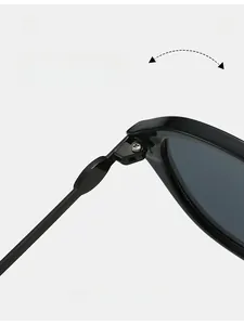 Macro view of a durable metal hinge on stylish cat-eye sunglasses with reinforced screws