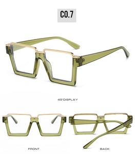 Detail view of square olive green semi-rimless frames with gold metal nose bridge