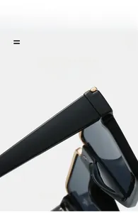 Close-up of flexible semi-rimless sunglasses frame with golden metal hinge detail