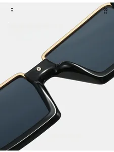 Detail view of comfortable nose pads on black and gold semi-rimless sunglasses