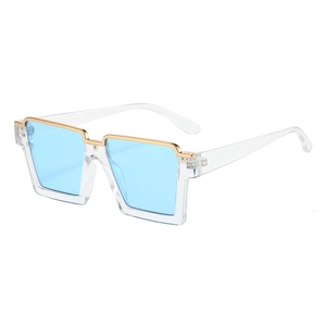 Modern square oversized semi-rimless sunglasses with gold metal trim and blue lenses