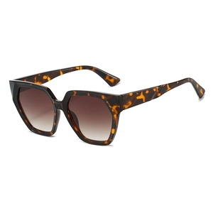 Polygonal tortoise shell sunglasses with gradient brown lenses in a 45-degree side view