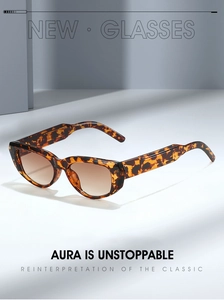 Detail of vintage leopard print cat eye sunglasses with thick tortoiseshell frame
