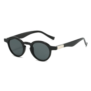 Retro small oval black sunglasses with silver temple accents on a white background