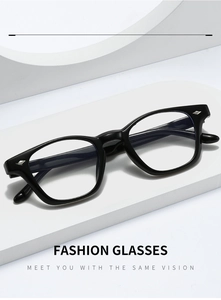 Detailed view of glossy black TR frame glasses on a minimalist geometric display