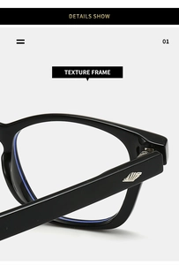 Close-up of black TR eyeglass frame featuring silver wing-shaped metal temple decor