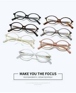 Multiple stylish oval-frame glasses in assorted colors with sleek golden metal accents