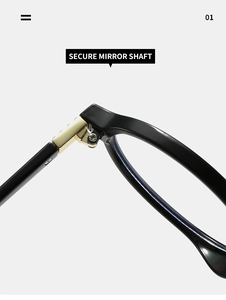 Detail showing the secure golden metal mirror shaft hinge of black oval glasses