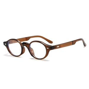 Classic TR90 round frame glasses in amber tortoiseshell with decorative diamond rivets