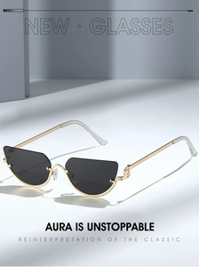 Detail of metal cat-eye sunglasses with unique musical note design on the golden temple