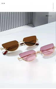 Detailed close-up of metallic cat eye sunglasses with floral accents on a geometric stand
