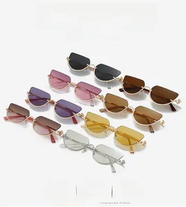 Detailed grid of seven colorful cat-eye metal sunglasses with diverse tinted lenses