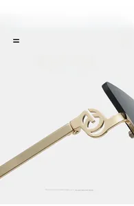 Detail of gold metal hinge with cutout design on cat-eye sunglasses temple arm