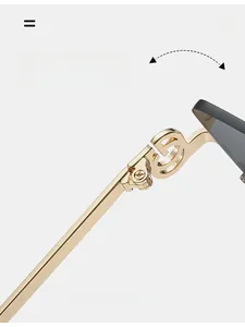 Close-up of golden metal hinges and durable temples on retro cat-eye sunglasses